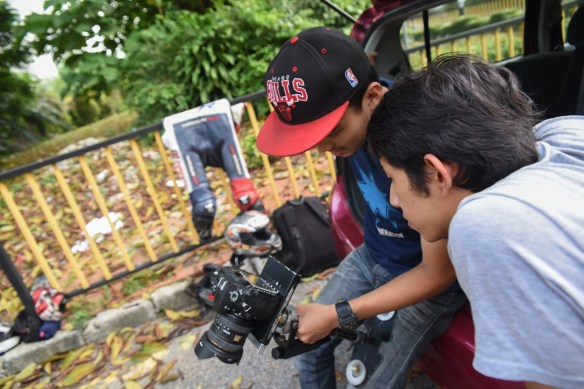 Assessment time, our director and also test rider looking over some shots the team made during the MT-09 filming... A lot of "ermpfhh" and the "okay lah"